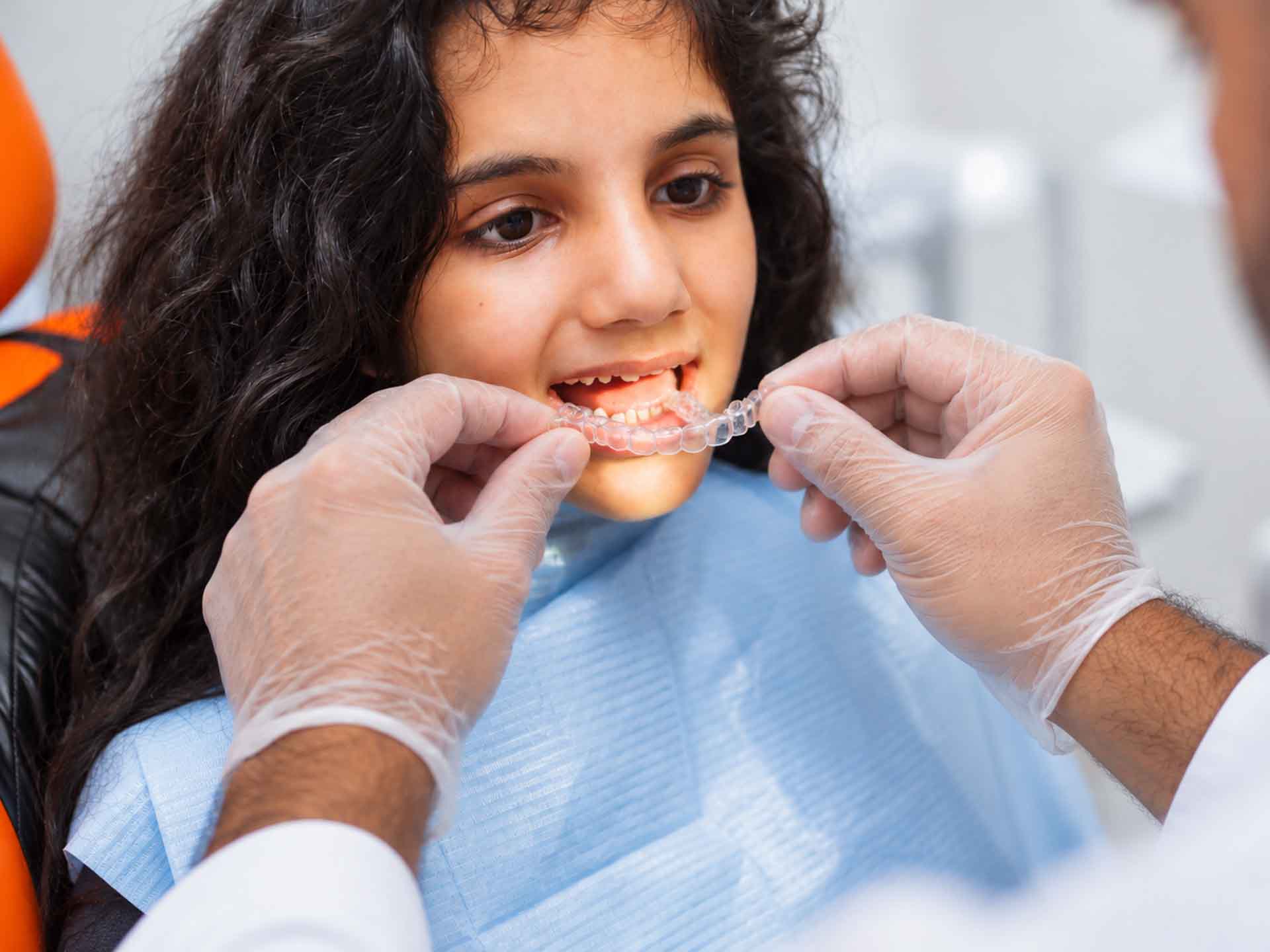 Patient receiving clear aligner orthodontic treatment in Grand Blanc, Michigan